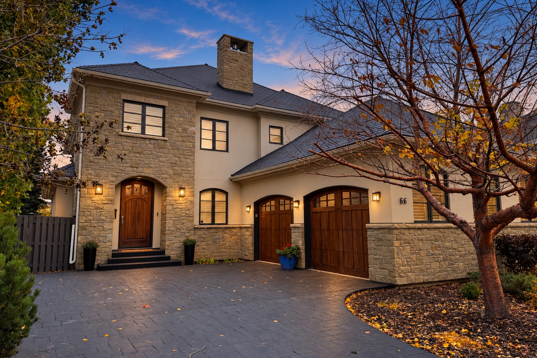 Stone-front custom two-storey home at 66 Mary Dover Drive SW in early fall